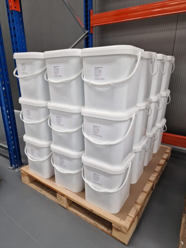 Oriental Specialty Packaging showing white buckets on a pallet