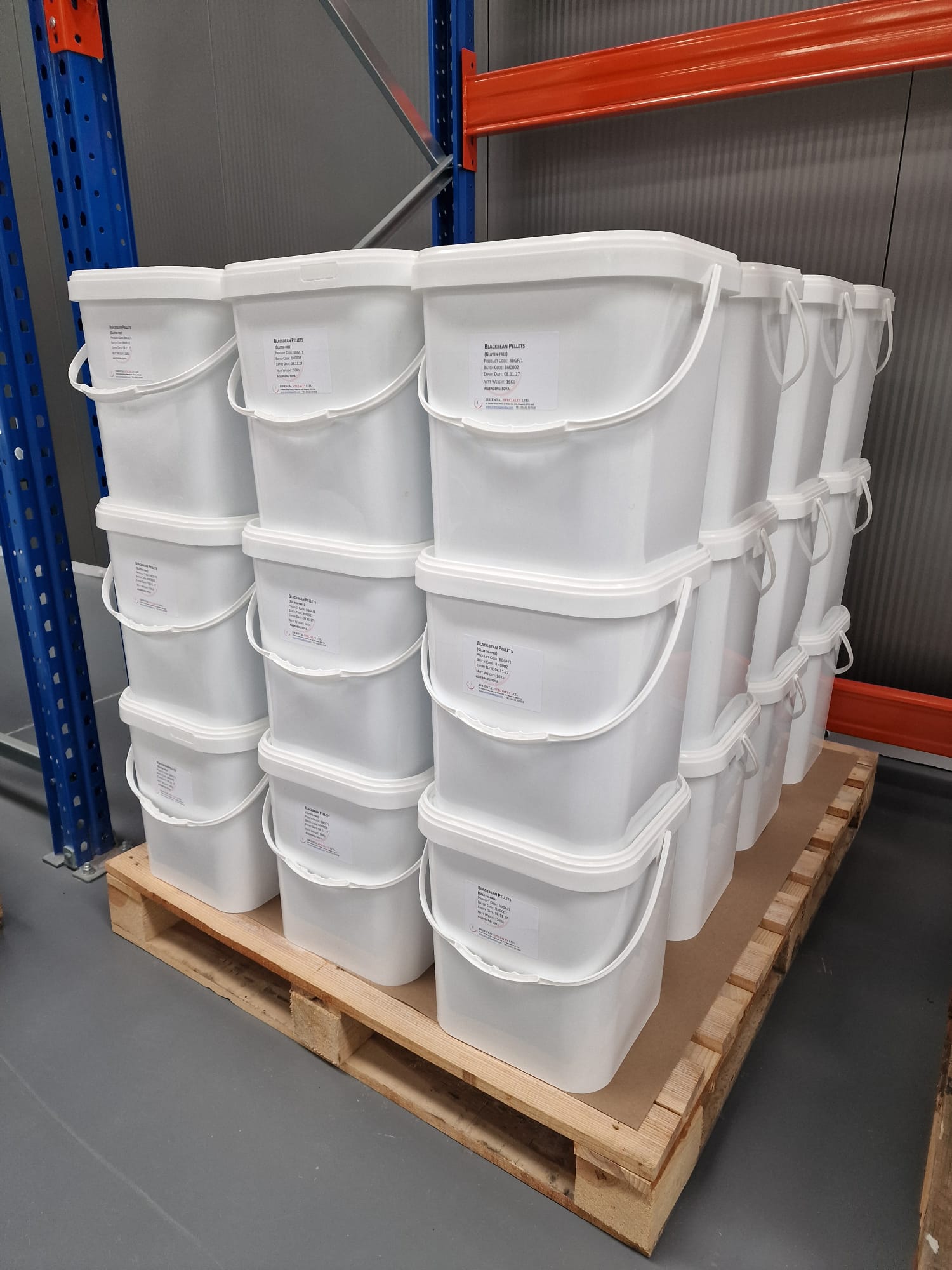Oriental Specialty Packaging showing white buckets on a pallet